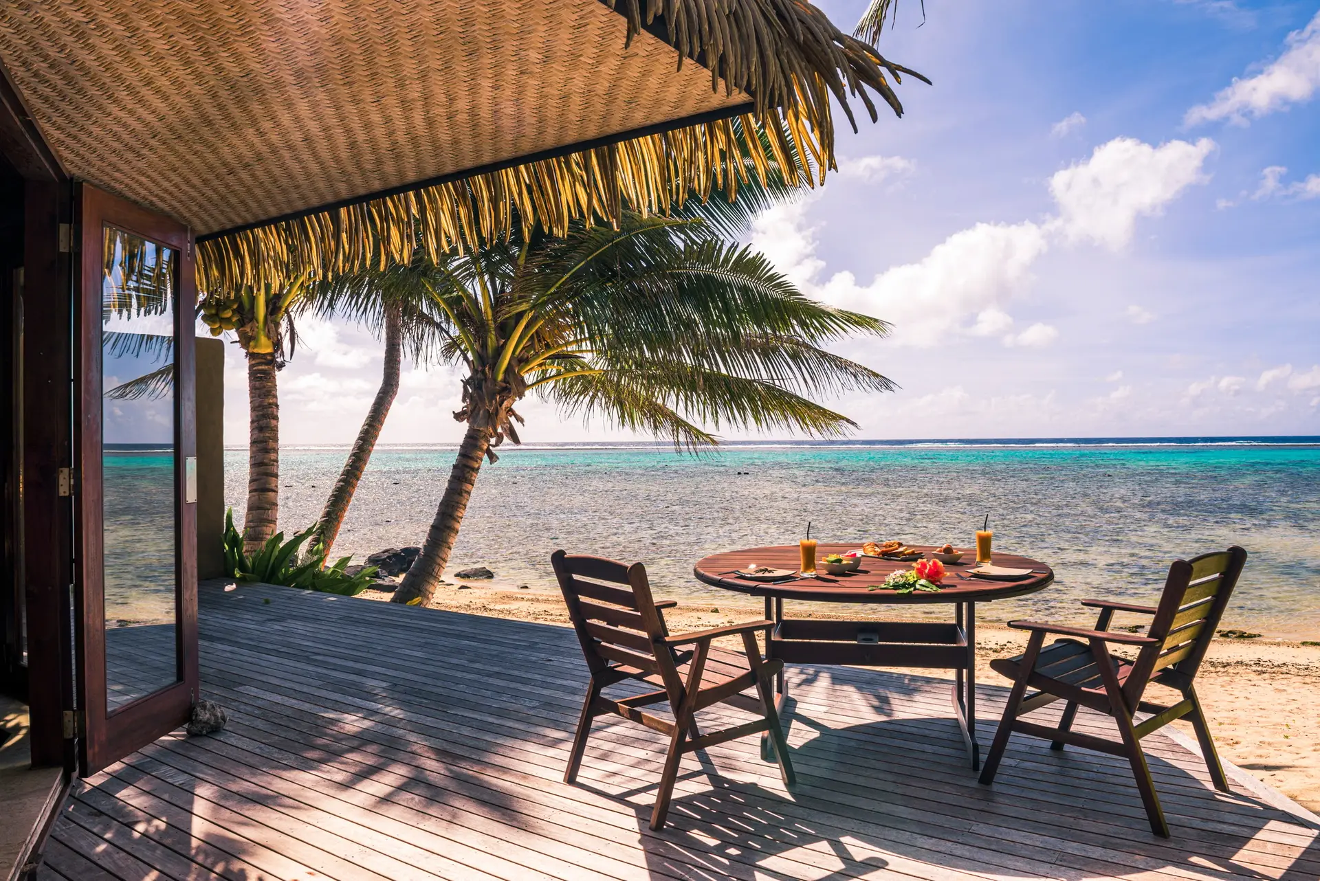 Luxury Villa accommodation with sea views of the tropical Pacific ocean and palm trees with breakfas