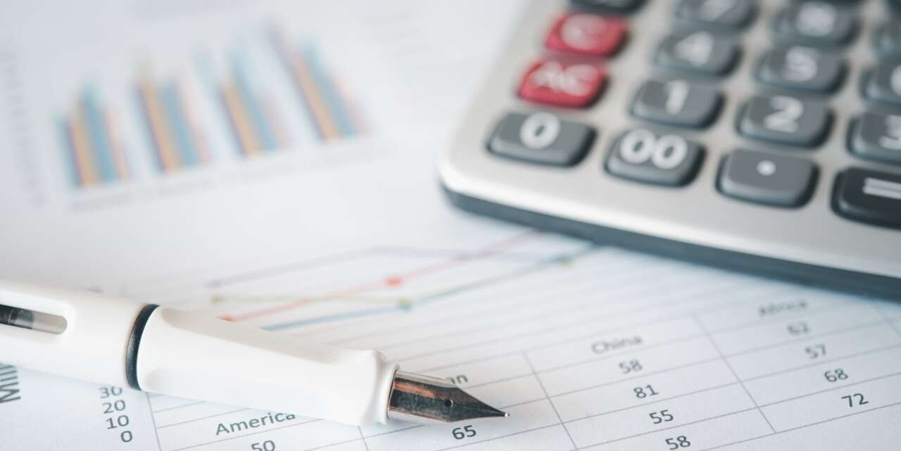 Bill and calculator with pen, paper bill charge.