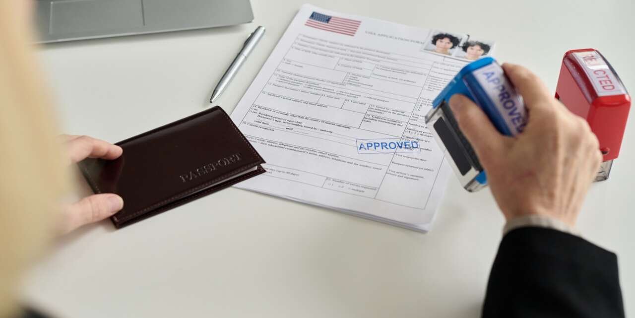 Immigration office worker approving visa