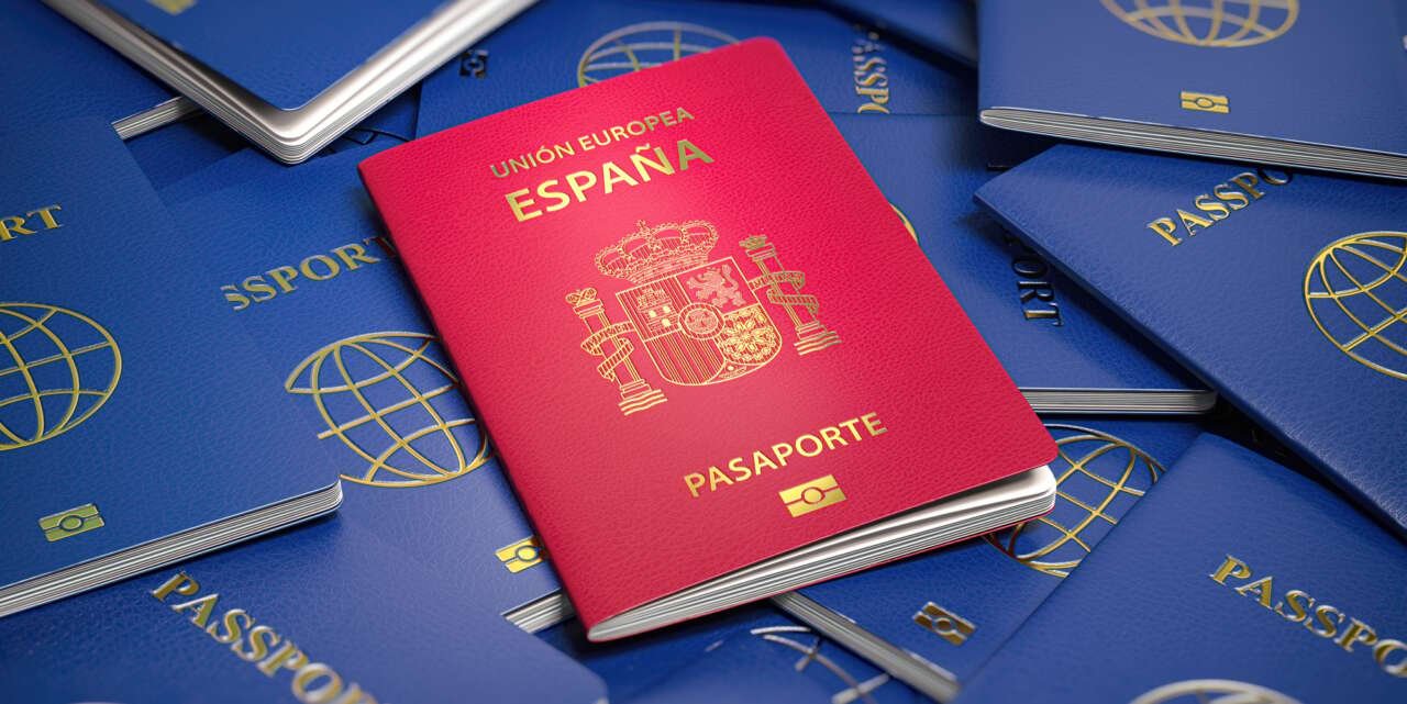 Passport of Spain on the pile of passports of other countries.