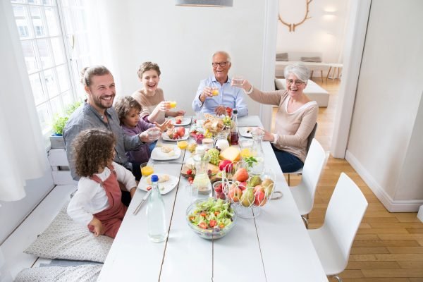 Happy extended family having lunch at home